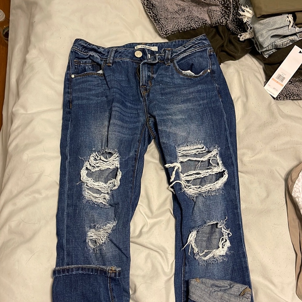 ripped jeans; barely worn